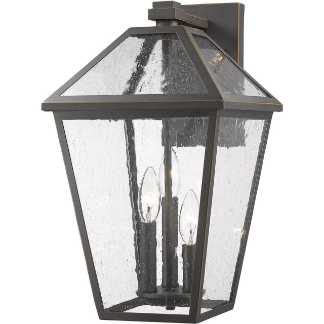 Z-Lite Talbot 3 Light 18 Inch Tall Outdoor Wall Light in Rubbed Bronze with Seedy Glass 579B-ORB